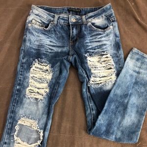 Destressed acid wash low rise skinny jeans